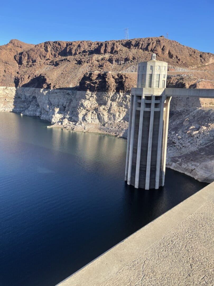 A tower that is in the middle of water.