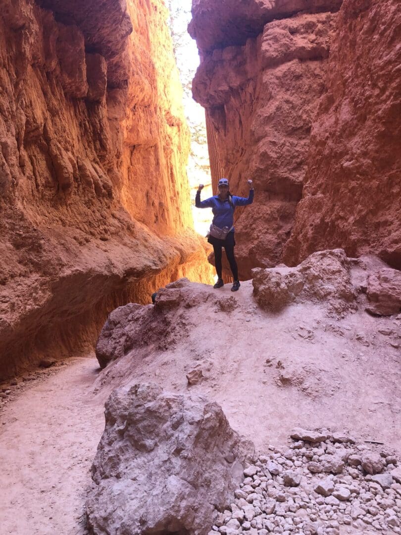 A person standing on the side of a mountain