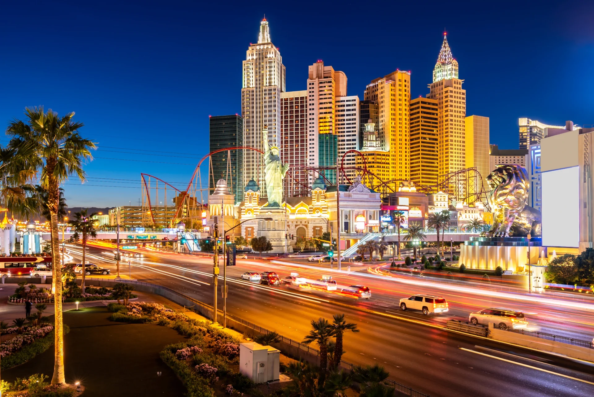 A city skyline with many buildings and cars on the road.